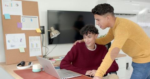 Two Male Coworkers Collaborating in a Modern Office Setting