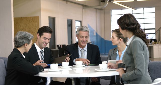 Business people drinking coffee during a meeting