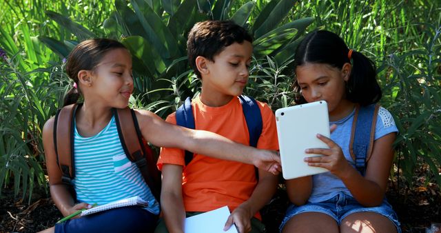 Diverse Kids Using Tablet and Studying Outdoors Together - Download Free Stock Images Pikwizard.com