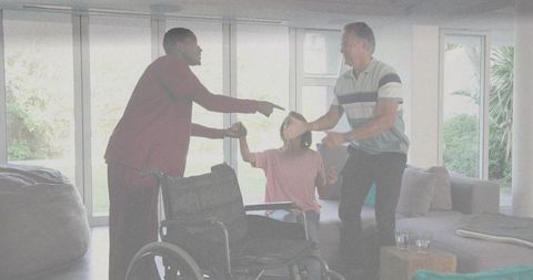 Caregiving dispute showing two men arguing while senior woman sits near wheelchair