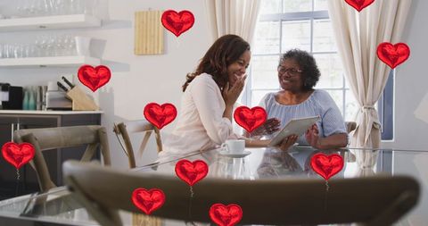 Two Women Enjoying Digital Communication between Friends