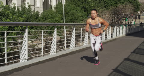 Caucasian Woman Running in Urban Area on Sunny Day