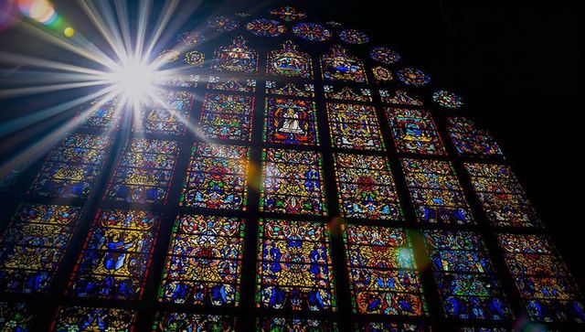 Sunlit stained glass in gothic cathedral