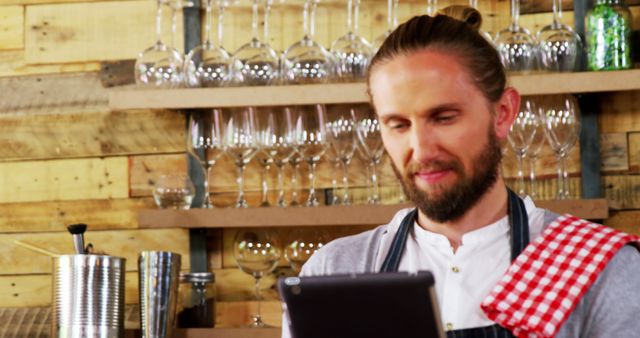 Barista Relaxing in Cozy Coffee Shop Reading Tablet - Download Free Stock Images Pikwizard.com