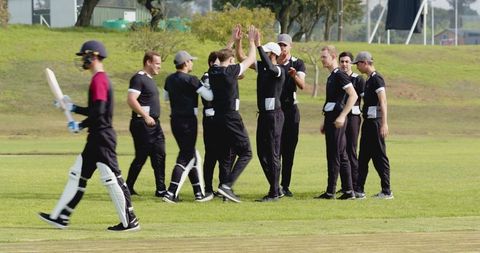 Team Celebrates Victory in Energetic Cricket Match