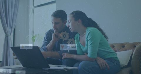 Couple Exploring Social Media Technology on Laptop at Home