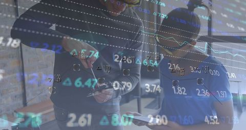 financial data overlay on two people working in workshop - Download Free Stock Images Pikwizard.com