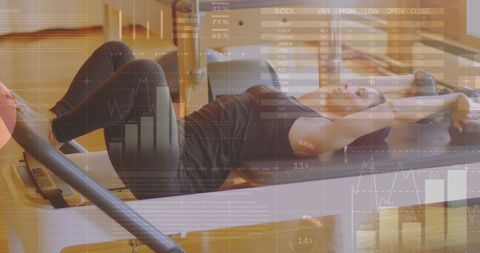 Woman engaging in pilates reformer exercise for fitness