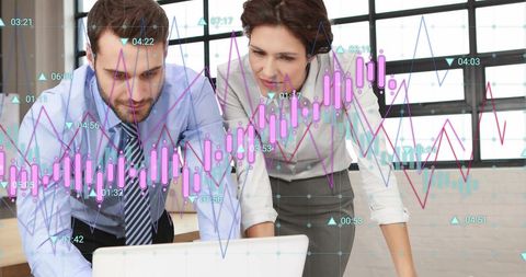 Colleagues analyzing business data with digital graphics