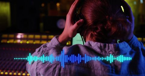 Audio engineer in recording studio mixing sound