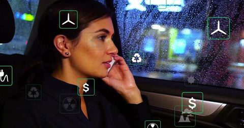 Businesswoman using mobile in car with augmented reality finance and eco risk analytics
