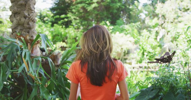 Young Woman Exploring Lush Green Garden During Daytime - Download Free Stock Images Pikwizard.com