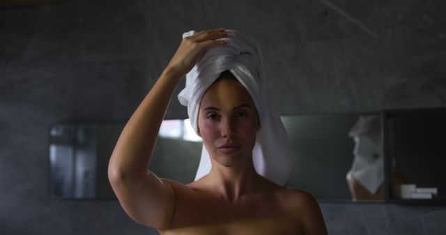 Woman in Bathroom with Towel Wrapped Around Hair - Download Free Stock Images Pikwizard.com