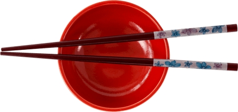 Transparent view of red bowl with colorful chopsticks top down