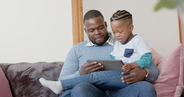 Father and Son Bonding While Using Digital Tablet - Download Free Stock Images Pikwizard.com