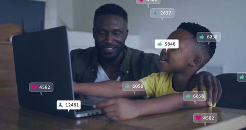 Black father guiding son on laptop with social media likes overlays, family digital learning