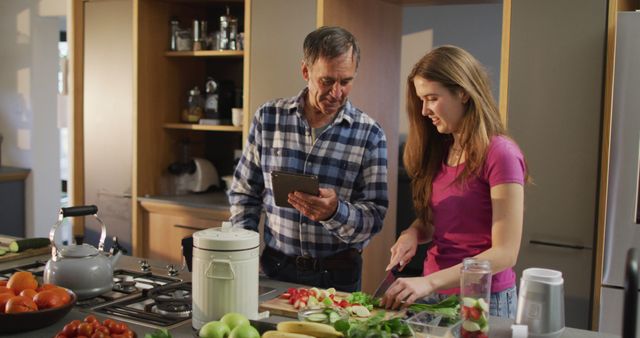 Happy Senior Father and Teenage Daughter Preparing Healthy Drink in Modern Kitchen - Download Free Stock Images Pikwizard.com