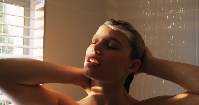 Woman taking a shower in bathroom at home 4k