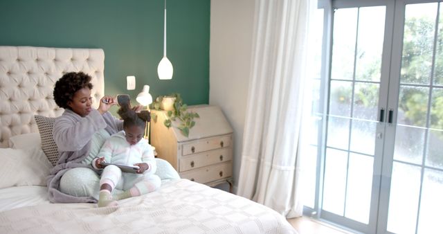 Mother Braiding Daughter's Hair in Bright Bedroom - Download Free Stock Images Pikwizard.com