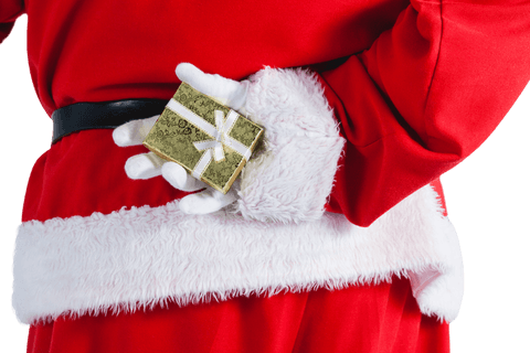 Transparent midsection of santa claus hiding gift box