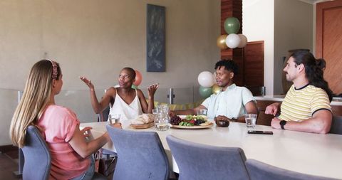 Diverse Group Friends Celebrating Gathering Around Dining Table