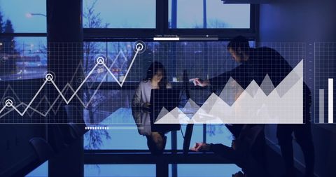 Business Meeting with Digital Interface Charts Display