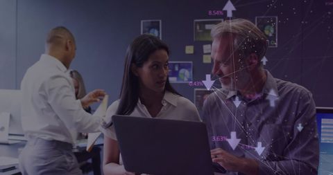 Diverse Business Team Analyzing Global Market Data in Office