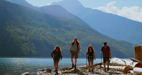 Diverse Group of Hikers Adores Stunning Mountain Lake Scenery - Download Free Stock Images Pikwizard.com