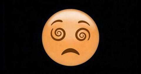 Spiral eyes emoji face on black background expressing confusion