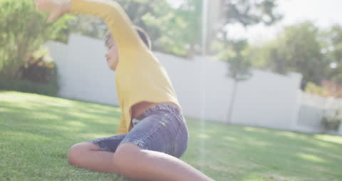 Joyful Boy Playing in Sunny Garden