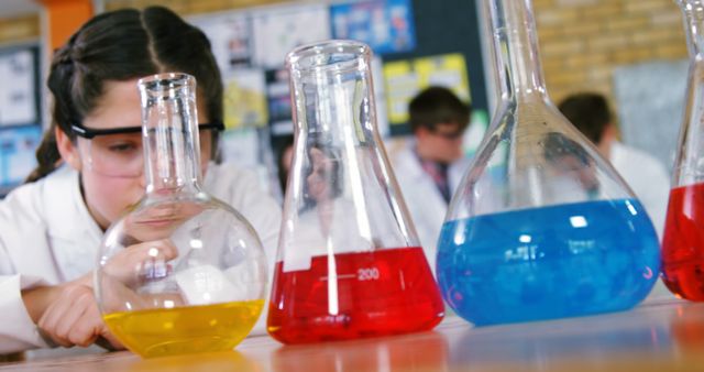 Focused Student Conducting Chemistry Experiment in Classroom - Download Free Stock Images Pikwizard.com