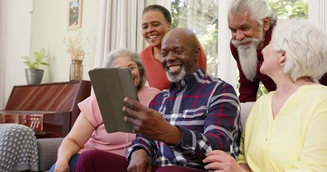 Senior Friends Connecting with Tablet at Home - Download Free Stock Images Pikwizard.com