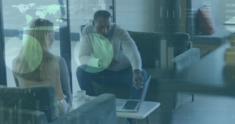 Tech-Driven Office Collaboration with Diverse Team Discussing Data Analytics