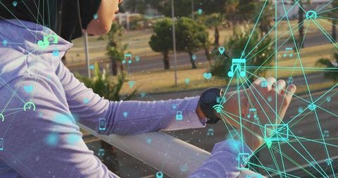 Woman in Hijab Using Smartwatch with Digital Media Network Overlay