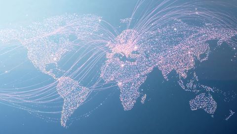 Global digital network map showing glowing nodes, luminous data flows and interconnected routes