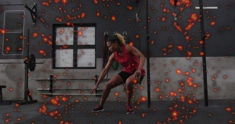 Lunging female athlete training in industrial gym with ember overlay for dynamic strength