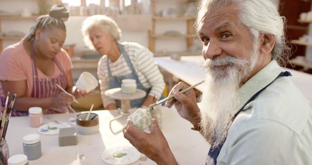 Seniors and Adults Painting Ceramics in Art Class - Download Free Stock Images Pikwizard.com