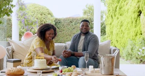 Couple Celebrating with Dessert and Champagne Outdoors