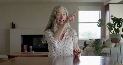 Senior Woman Engaging in Conversation at Home - Download Free Stock Images Pikwizard.com