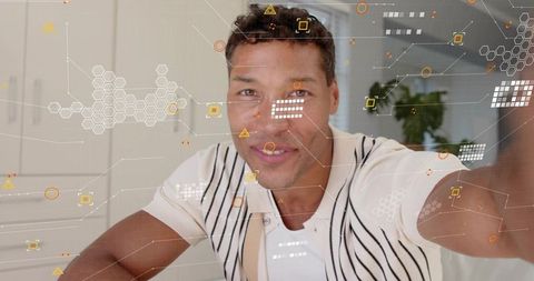 Mid-adult man recording vlog with ar interface at home reaching toward camera