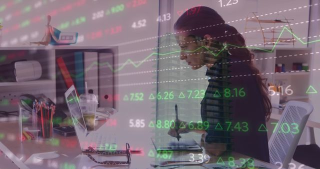 Businesswoman Analyzing Stock Market Data with Laptop and Pen - Download Free Stock Images Pikwizard.com