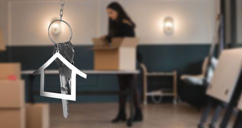 Keys and real estate concept unpacking new home