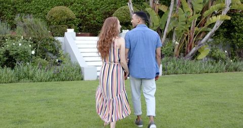Romantic Couple Walking Towards Garden Stairs Together