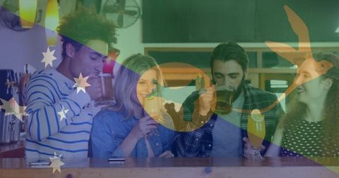 Group of four young friends chatting and raising their drinks at a wooden bar counter with metal taps in view. Ideal for representing camaraderie, leisure activities, and nightlife fun. Perfect for marketing materials related to beverage industry, social events, and hospitality.