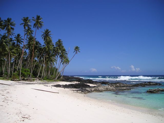 High-quality image of a tropical beach perfect for travel-themed promotions, vacation packages, relaxation concepts, and holiday advertisements. Ideal for use in travel brochures, websites, promotional materials, and social media content showcasing idyllic beach destinations and serene getaways.