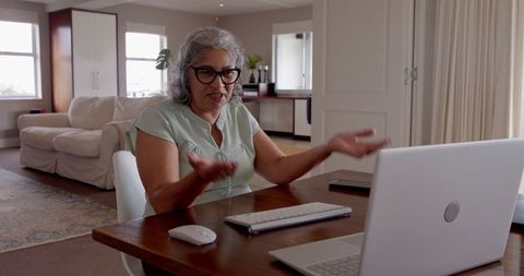 Senior Woman Smiling During Video Call at Home Office