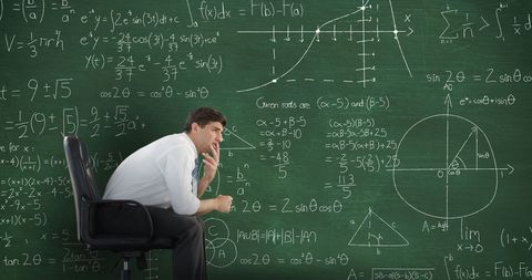 Thoughtful Young Mathematician Analyzes Chalkboard Equations - Download Free Stock Images Pikwizard.com