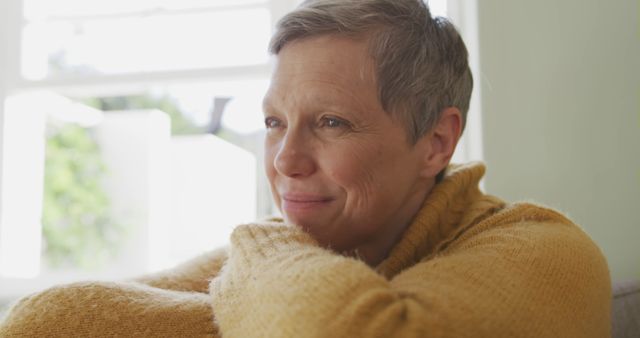 Pensive Mature Woman Relaxing by Window, Enjoying Peaceful Moment - Download Free Stock Images Pikwizard.com