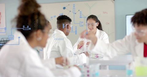 Students conducting chemistry experiment with Chinese girl holding pink test tube