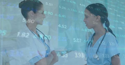 Healthcare Professionals Analyzing Financial Data in Medical Setting